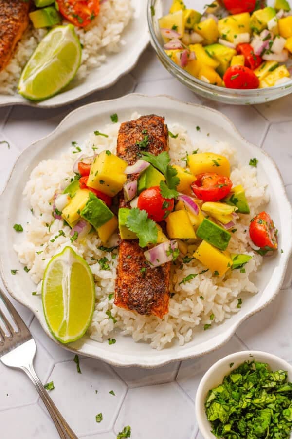 Air fryer cajun salmon over rice with mango salsa on to of it.