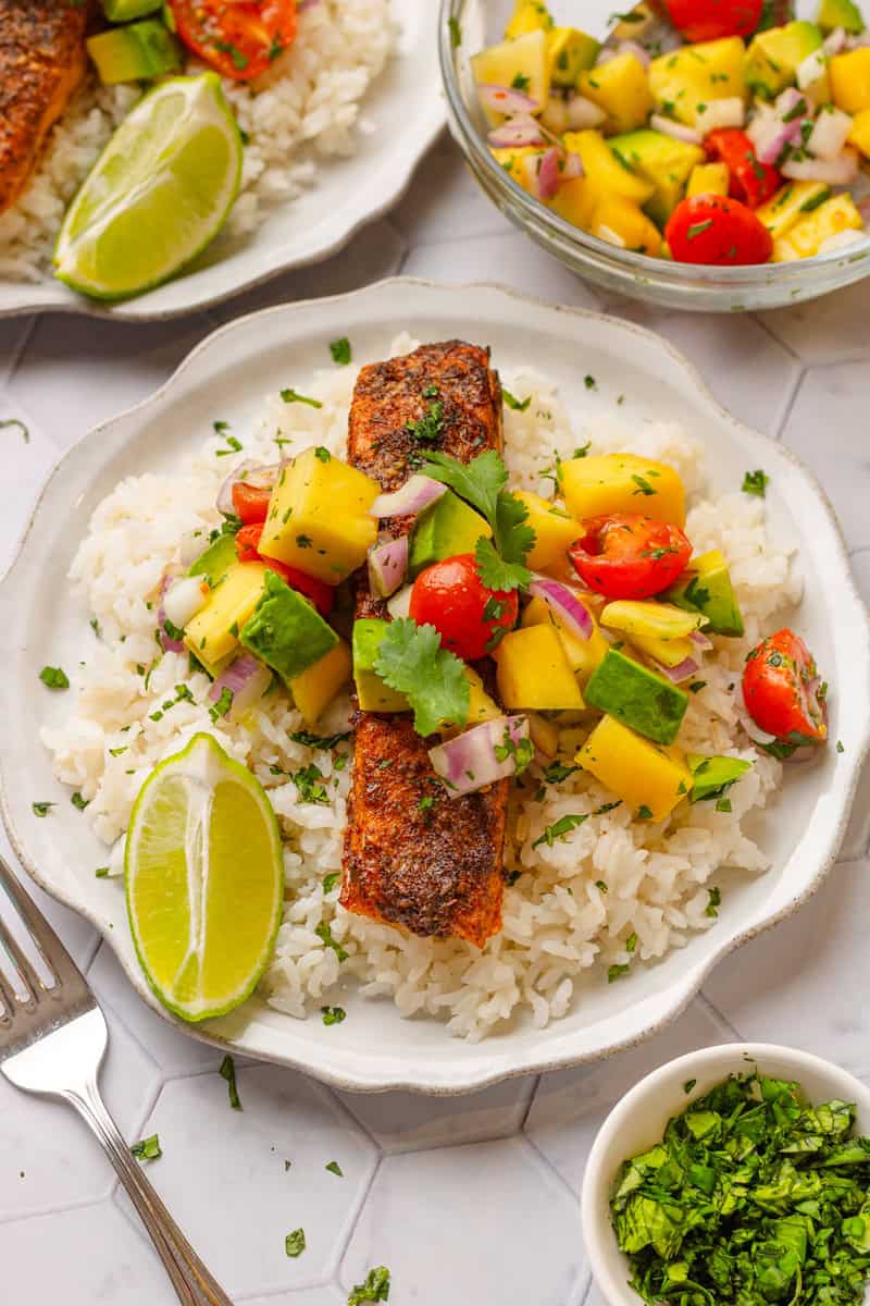 Air fryer cajun salmon over rice with mango salsa on to of it.