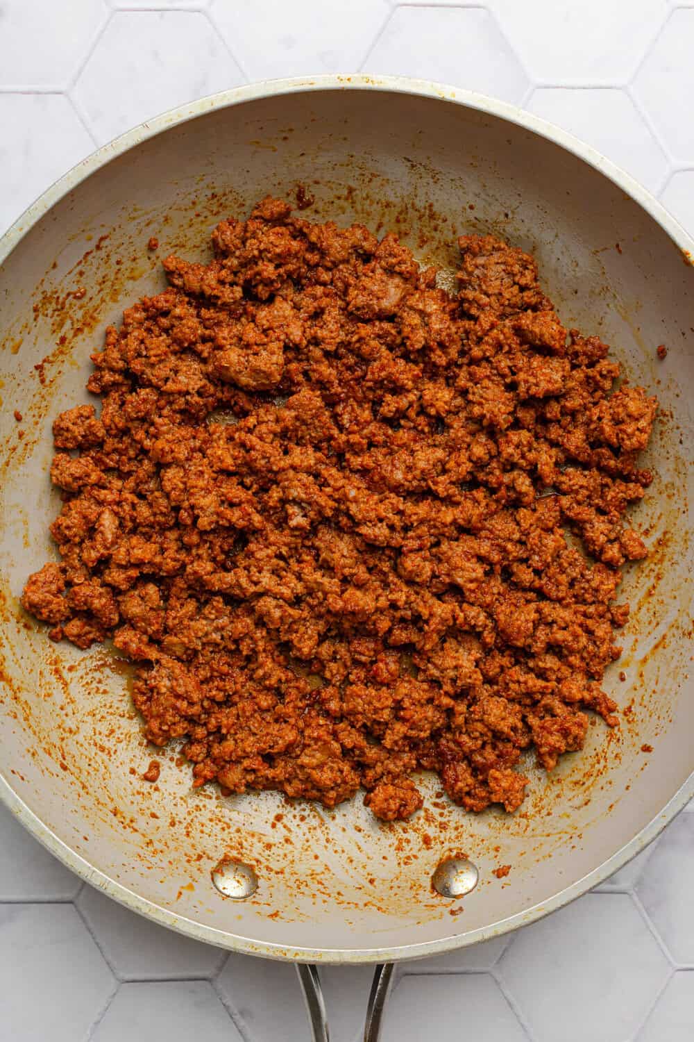 Cooked ground beef taco meat in a skillet.