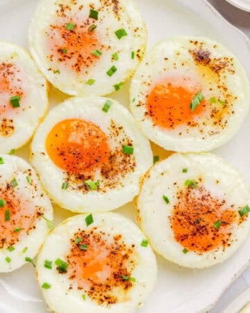 Plate of muffin tin cooked eggs.