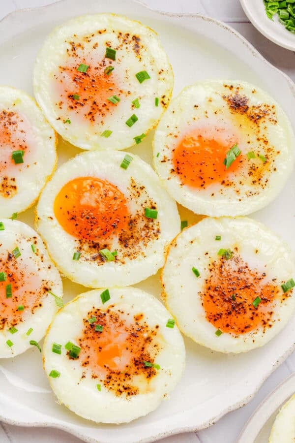 Plate of muffin tin cooked eggs.