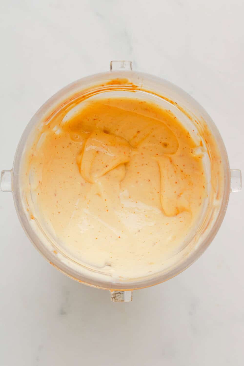 Blended cottage cheese and seasoning in a blender bottle. 