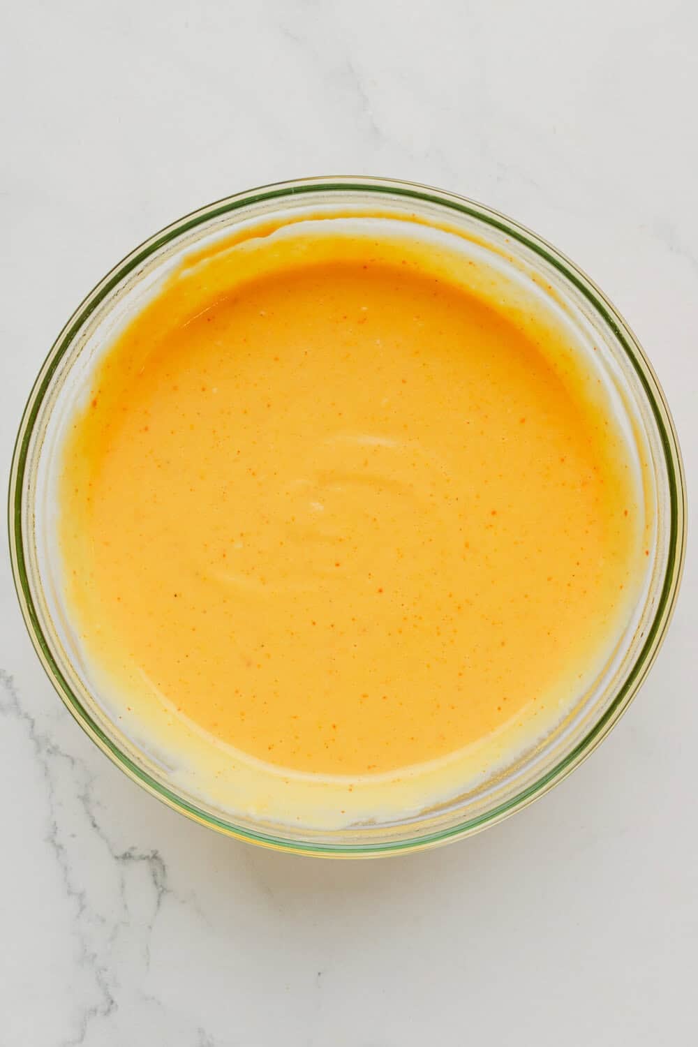 Blended cottage cheese protein queso sauce in a bowl. 