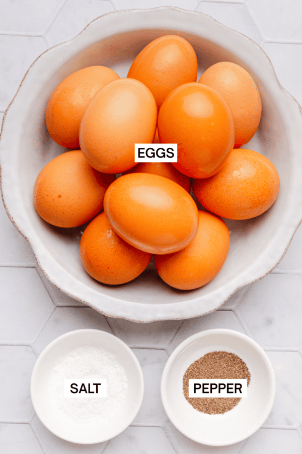 Ingredients for baked eggs with labels over each ingredient.