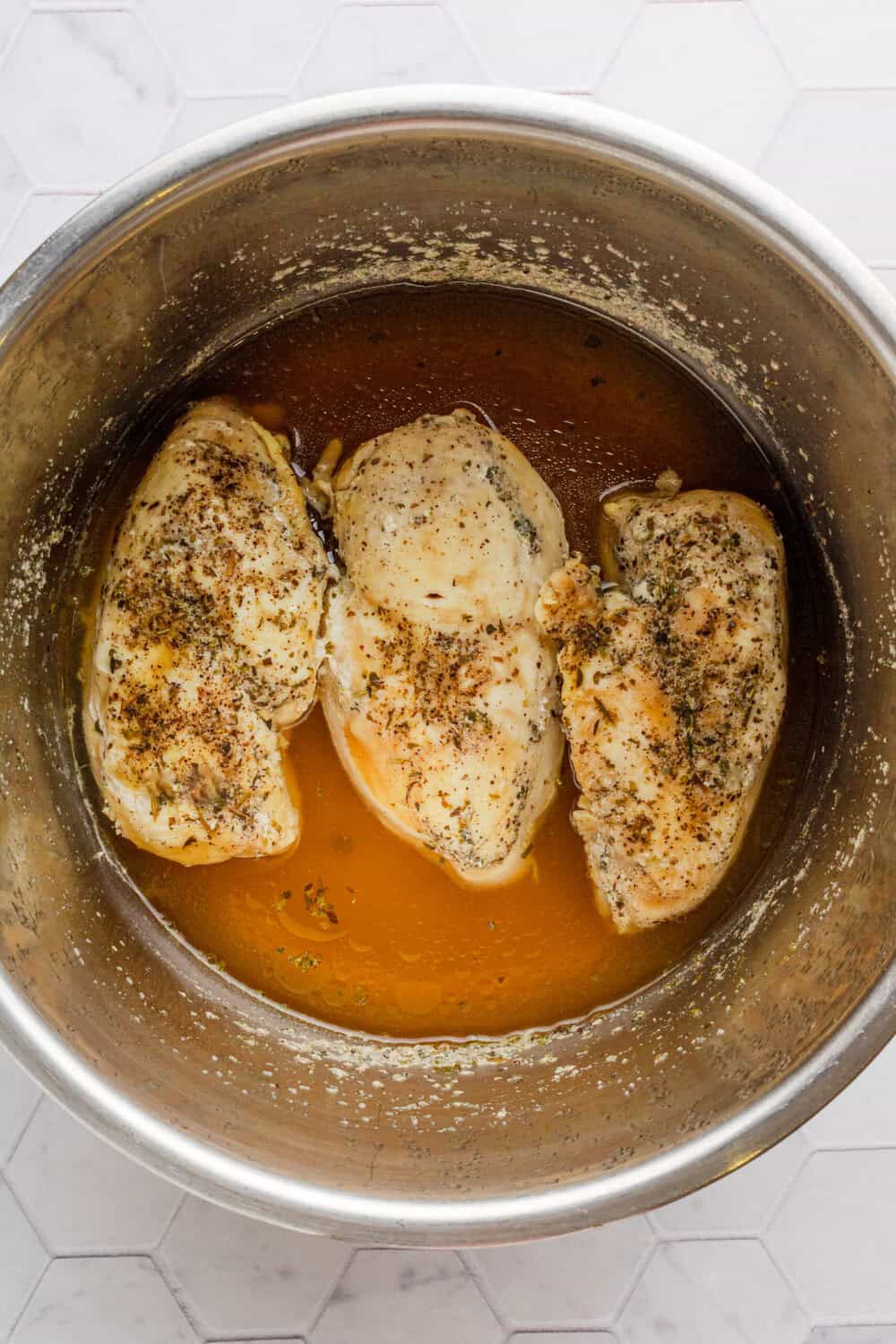 Cooked chicken breast seasoned in the Instant Pot. 
