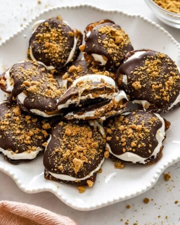 White plate filled with smashed date s'mores.