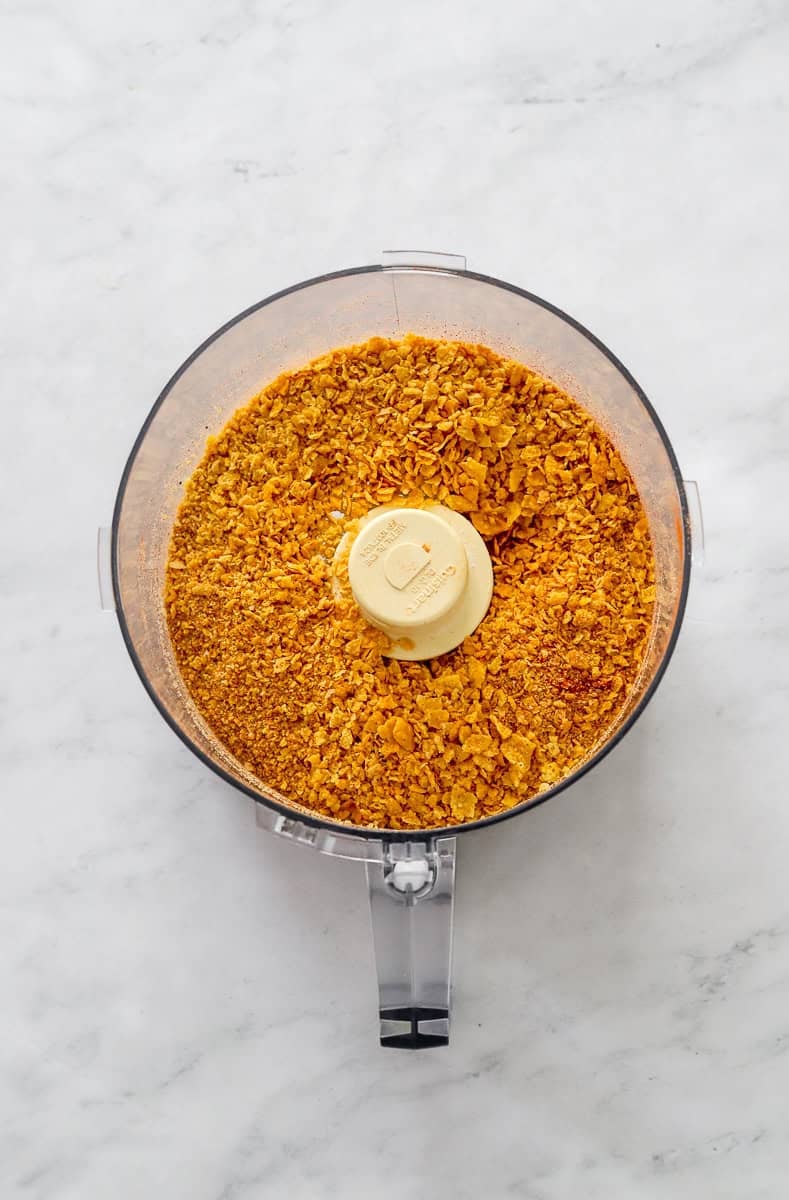 Blended cornflake seasoning chicken coating in a food processor. 