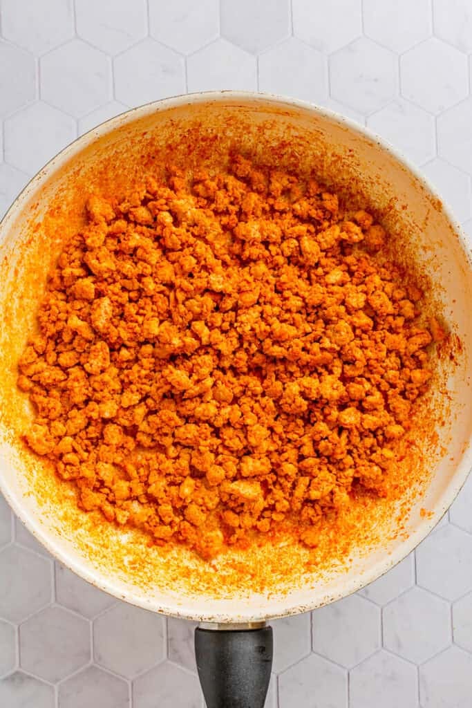 Pan filled with cooked taco meat ground chicken. 