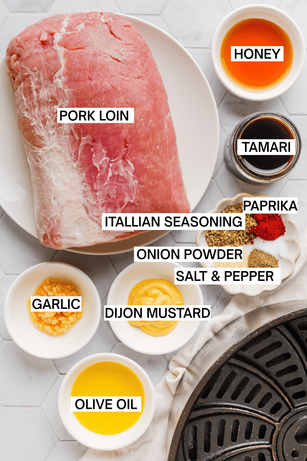 Air fryer pork loin ingredients in bowls with labels over each ingredient. 