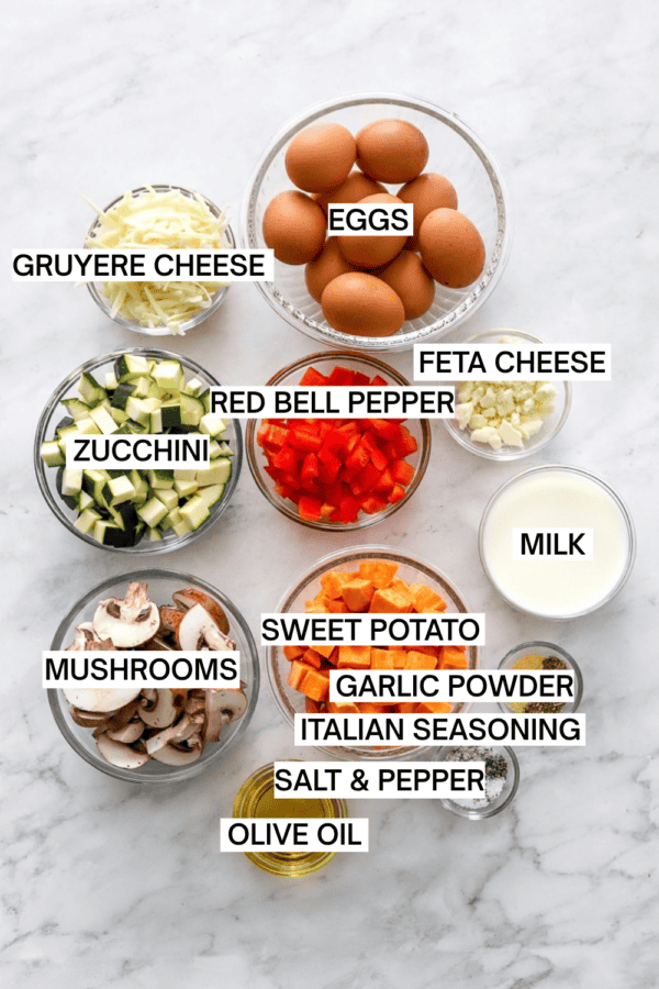 Ingredients for baked vegetable frittata in bowls with labels over each ingredient.